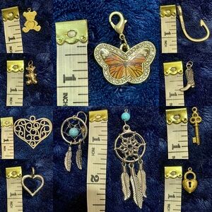 10 Assorted gold and silver toned charms